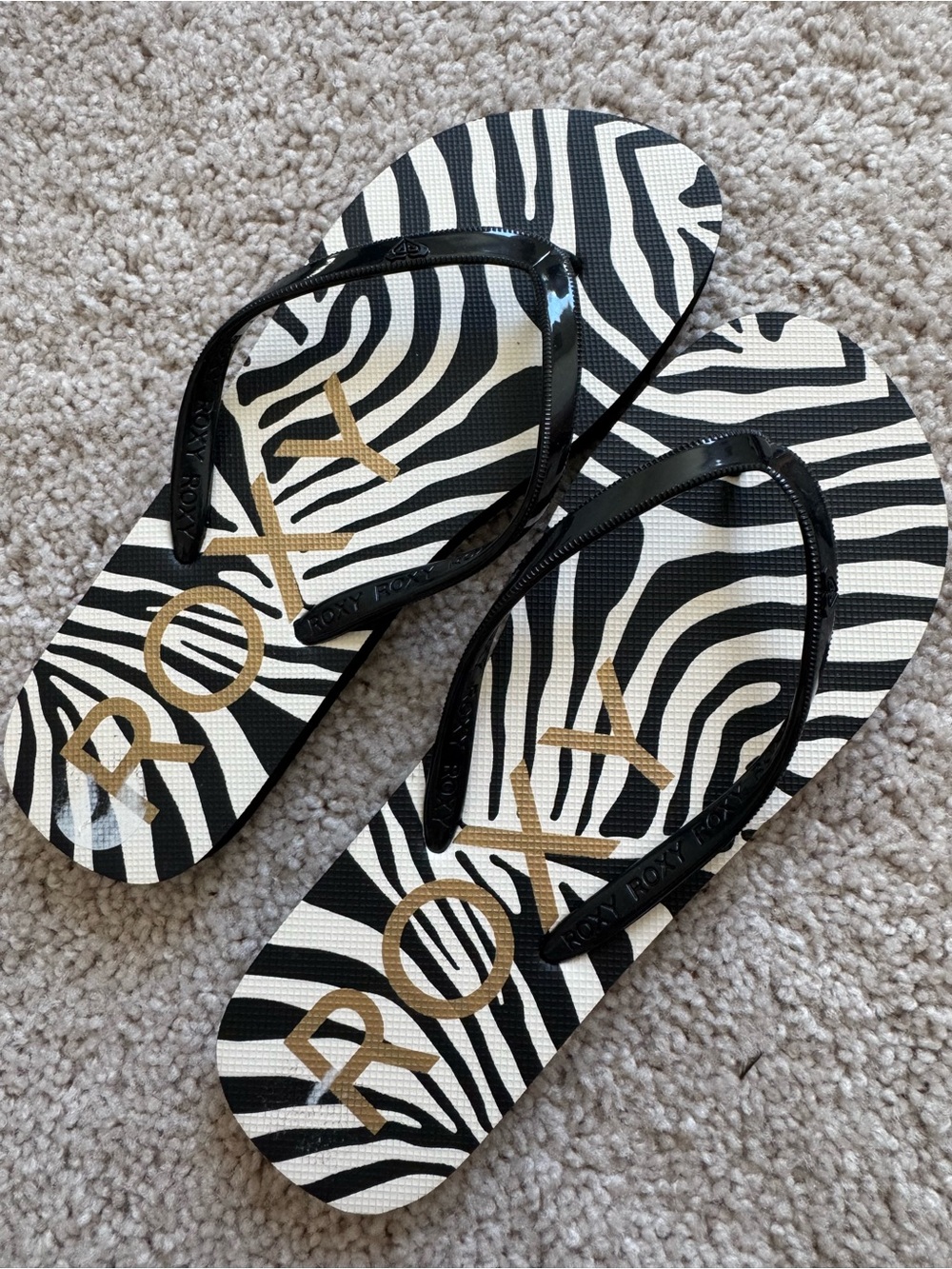 Roxy Black & White Zebra Print Flip Flops with Gold Logo